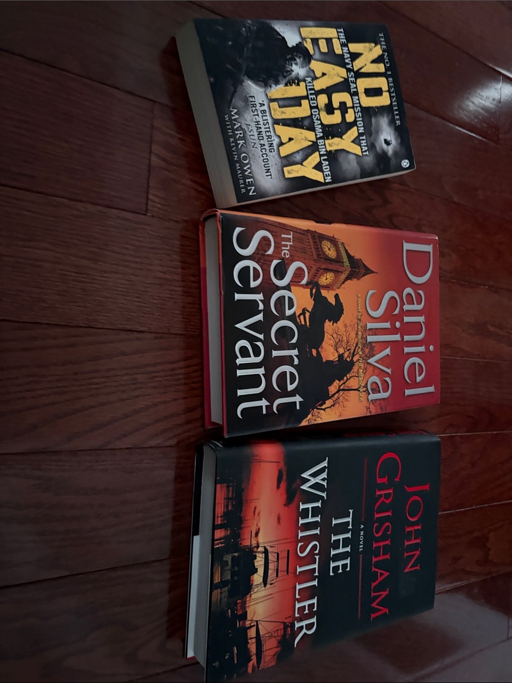 Collection of Three Thriller Hardcover Books - Red, Black, Orange Covers